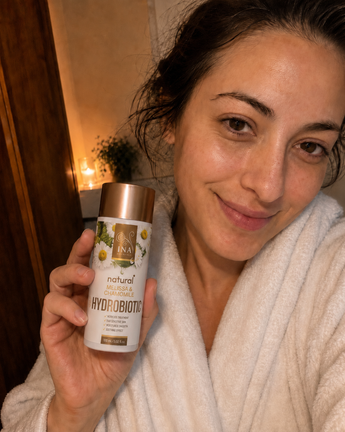 Customer holding INA Hydrobiotic Melissa Chamomile bottle